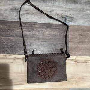 Elegant Brown Crossbody Bag with Artistic Design
